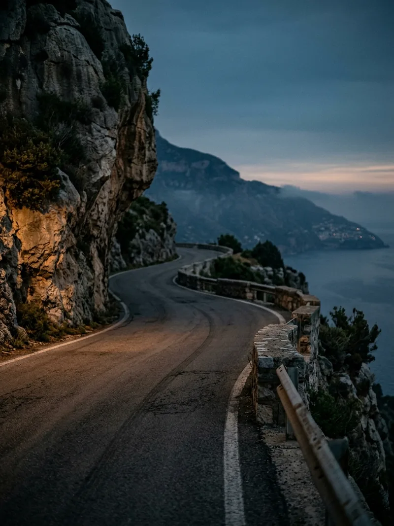Winding coastal road on the French Riviera at dusk
